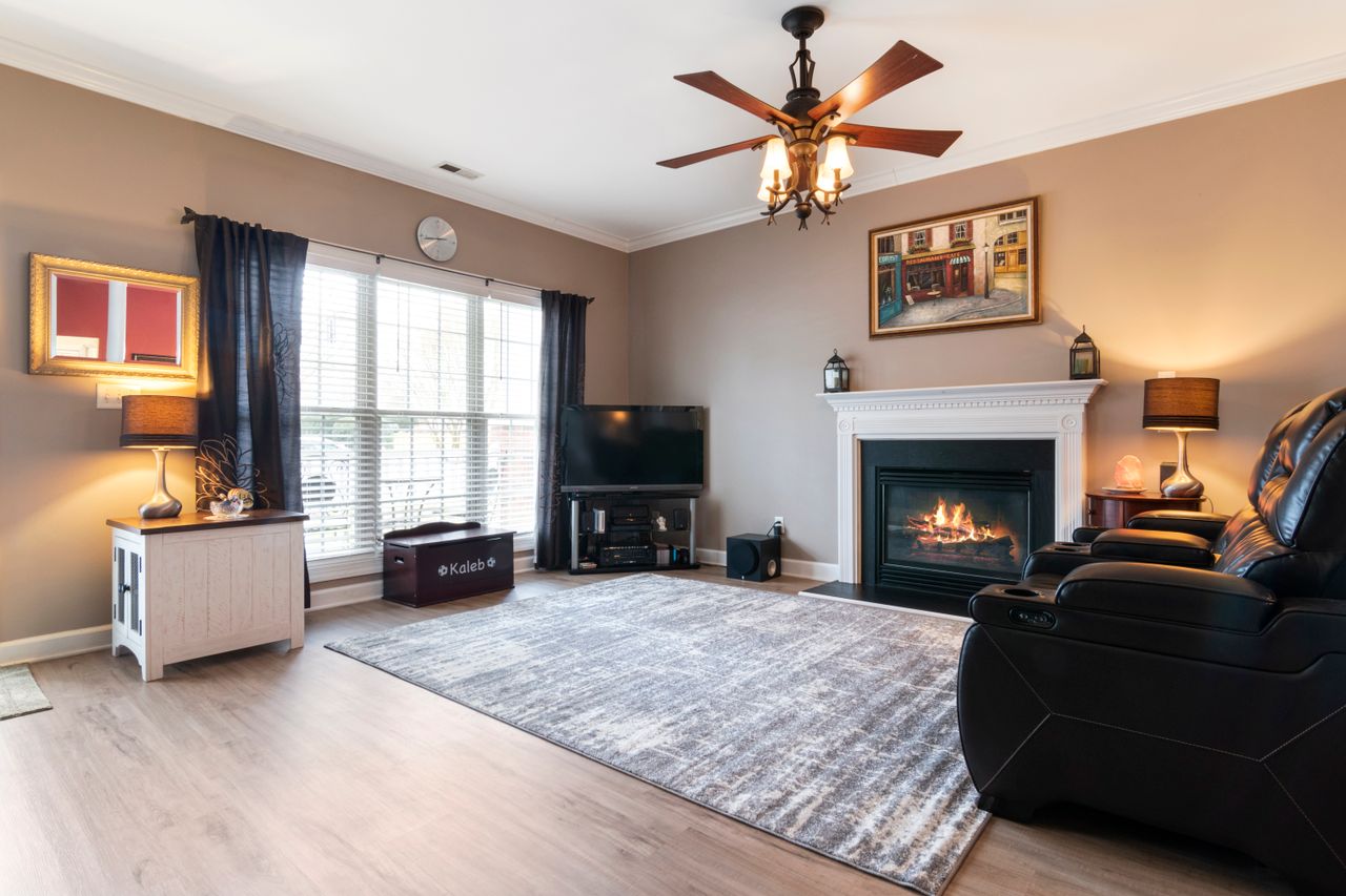 About Inviting living space featuring a fireplace, modern decor, and comfortable seating.
